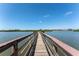 Scenic shot down a wooden dock on the Intracoastal waterway to nearby residential area at 14506 Alejo Ct, Seminole, FL 33776