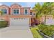 Charming two-story townhome featuring a two-car garage and well-maintained landscaping at 14506 Alejo Ct, Seminole, FL 33776