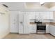 Functional kitchen features stainless appliances and ample white cabinetry, offering plenty of storage at 14506 Alejo Ct, Seminole, FL 33776