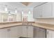 Well-lit kitchen featuring granite countertops, stainless steel dishwasher, and an open layout at 14506 Alejo Ct, Seminole, FL 33776