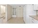 Bright kitchen features tile floors, white appliances, and a convenient door to the outside at 14506 Alejo Ct, Seminole, FL 33776