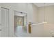 Bright loft space with a view of the sliding glass door to the outside and built in shelving at 14506 Alejo Ct, Seminole, FL 33776
