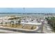 Wide angle shot showcasing a working marina, water, parked cars and boats at 14506 Alejo Ct, Seminole, FL 33776