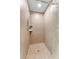 Tiled standup shower with adjustable shower head, and glass enclosure at 14506 Alejo Ct, Seminole, FL 33776