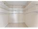 Spacious walk-in closet with multiple wire shelves for optimal storage at 14506 Alejo Ct, Seminole, FL 33776