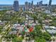 A vibrant aerial view shows a charming neighborhood with easy access to downtown, marked by an arrow at 146 8Th Ne Ave, St Petersburg, FL 33701