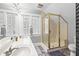 Bathroom featuring double vanity, tile floors, and glass-enclosed shower at 146 8Th Ne Ave, St Petersburg, FL 33701