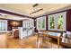 Open dining area with hardwood floors, a banquette seating, and connection to the living room at 146 8Th Ne Ave, St Petersburg, FL 33701