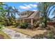 Side view of a charming home showcasing its architectural style, lush landscaping, and inviting outdoor space at 146 8Th Ne Ave, St Petersburg, FL 33701