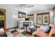 Home office featuring a desk, many windows, a ceiling fan, and unique checkered flooring at 146 8Th Ne Ave, St Petersburg, FL 33701