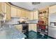 Kitchen featuring stainless appliances, blue countertops and cabinetry at 146 8Th Ne Ave, St Petersburg, FL 33701