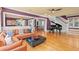 Spacious living room featuring hardwood floors, modern furniture, and a grand piano at 146 8Th Ne Ave, St Petersburg, FL 33701