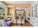 Bright living room with bar seating to kitchen, hardwood floors and built-in hutch at 146 8Th Ne Ave, St Petersburg, FL 33701