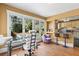 Bright living room with large windows, hardwood floors, adjacent to kitchen with bar seating at 146 8Th Ne Ave, St Petersburg, FL 33701