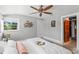 Bright main bedroom featuring a ceiling fan at 146 8Th Ne Ave, St Petersburg, FL 33701