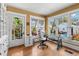 Bright office space with hardwood floors, large windows, and a stylish glass-top desk at 146 8Th Ne Ave, St Petersburg, FL 33701