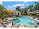 Sparkling pool and spa surrounded by lush tropical landscaping, with plenty of room for relaxing at 146 8Th Ne Ave, St Petersburg, FL 33701
