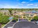 Aerial view of the property highlighting the community layout, parking, and nearby amenities at 1577 Chateaux De Ville Ct, Clearwater, FL 33764