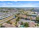 Wide aerial view of a community with townhomes near a bay and highway at 1577 Chateaux De Ville Ct, Clearwater, FL 33764