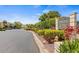 The community entrance with beautiful landscaping, creating a welcoming atmosphere at 1577 Chateaux De Ville Ct, Clearwater, FL 33764