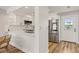Contemporary kitchen featuring white cabinets, stainless appliances, and a breakfast bar at 1577 Chateaux De Ville Ct, Clearwater, FL 33764