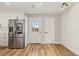 Bright and airy kitchen features stainless appliances and an adjacent back entrance at 1577 Chateaux De Ville Ct, Clearwater, FL 33764