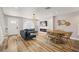 Spacious living area with stylish furnishings, hardwood floors, and modern lighting fixtures at 1577 Chateaux De Ville Ct, Clearwater, FL 33764