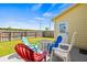 Cozy patio with a table and colorful chairs, perfect for outdoor relaxing and entertaining at 1577 Chateaux De Ville Ct, Clearwater, FL 33764