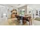Spacious dining room featuring modern furniture and a view to the landscaped yard at 1714 Cypress Ave, Belleair, FL 33756