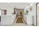 Bright kitchen featuring sleek white cabinetry, stainless steel appliances, and modern design at 1714 Cypress Ave, Belleair, FL 33756