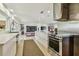 Modern kitchen showcasing stainless steel appliances, white countertops, and an open layout at 1714 Cypress Ave, Belleair, FL 33756