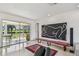 Stylish living area with a sliding door to the outside and a unique piece of artwork at 1714 Cypress Ave, Belleair, FL 33756