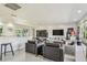Open living room with modern decor, comfortable seating, and a bright, airy atmosphere at 1714 Cypress Ave, Belleair, FL 33756
