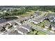 An aerial view of a neighborhood, ponds, and green spaces at 17737 Everlong Dr, Land O Lakes, FL 34638