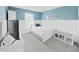 Bedroom with light blue walls, a white bed, white accents, and a window with modern blinds at 17737 Everlong Dr, Land O Lakes, FL 34638