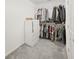 Well-organized walk-in closet with ample hanging space and a white dresser at 17737 Everlong Dr, Land O Lakes, FL 34638