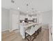 Modern kitchen features a quartz island with pendant lighting and stainless steel appliances at 17737 Everlong Dr, Land O Lakes, FL 34638