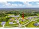 Aerial view of a home near a community lake and wooded area at 17804 Brewster Grn, Lutz, FL 33559