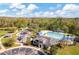 Aerial view of the community playground, clubhouse, and swimming pool at 17804 Brewster Grn, Lutz, FL 33559