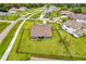 This aerial view highlights the backyard and the surrounding manicured lawns and landscaping at 17804 Brewster Grn, Lutz, FL 33559