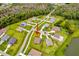 An aerial view shows this property in a neighborhood near a community lake at 17804 Brewster Grn, Lutz, FL 33559
