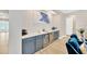Stylish bar area featuring custom cabinets, a wine cooler, and elegant decor for entertaining at 17804 Brewster Grn, Lutz, FL 33559