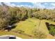 Aerial view of the community dog park with play equipment and room to roam at 17804 Brewster Grn, Lutz, FL 33559