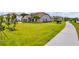 A spacious front yard with lush green grass and landscaping, offering a serene and inviting entrance at 17804 Brewster Grn, Lutz, FL 33559