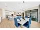 Open floorplan showcasing dining room, kitchen, and living room with lots of natural light at 17804 Brewster Grn, Lutz, FL 33559