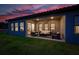 A covered patio with comfortable seating and a ceiling fan, offering a relaxing outdoor space at 17804 Brewster Grn, Lutz, FL 33559