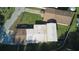 This aerial shot showcases the home's spacious yard, surrounding streets, and surrounding homes at 18121 Geraci Rd, Lutz, FL 33548