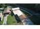 Aerial view of the house and surrounding landscaping with separate garages and long driveway at 18121 Geraci Rd, Lutz, FL 33548