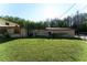 Exterior view of the home's lush backyard and surroundings at 18121 Geraci Rd, Lutz, FL 33548