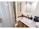 Modern bathroom featuring a vanity, a shower, and wood-look floors at 18121 Geraci Rd, Lutz, FL 33548
